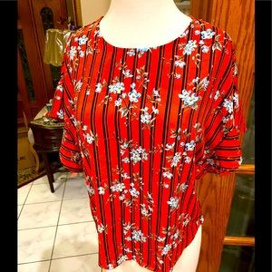 Blouse in Orange navy and light blue sbd white floral by ÁGAGI